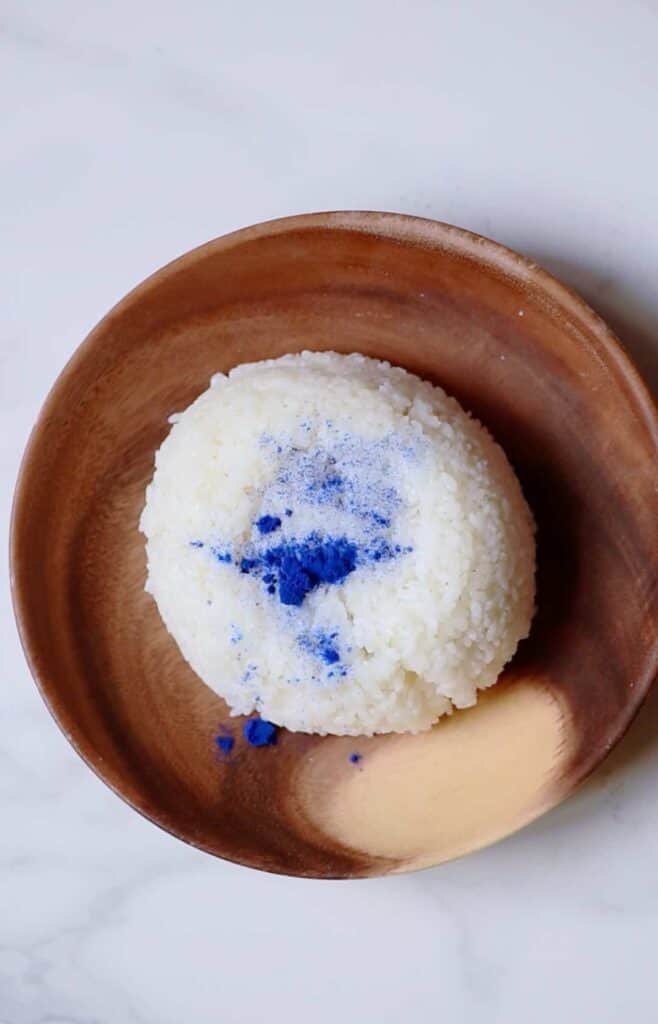 Cooked rice with blue coloring in a bowl