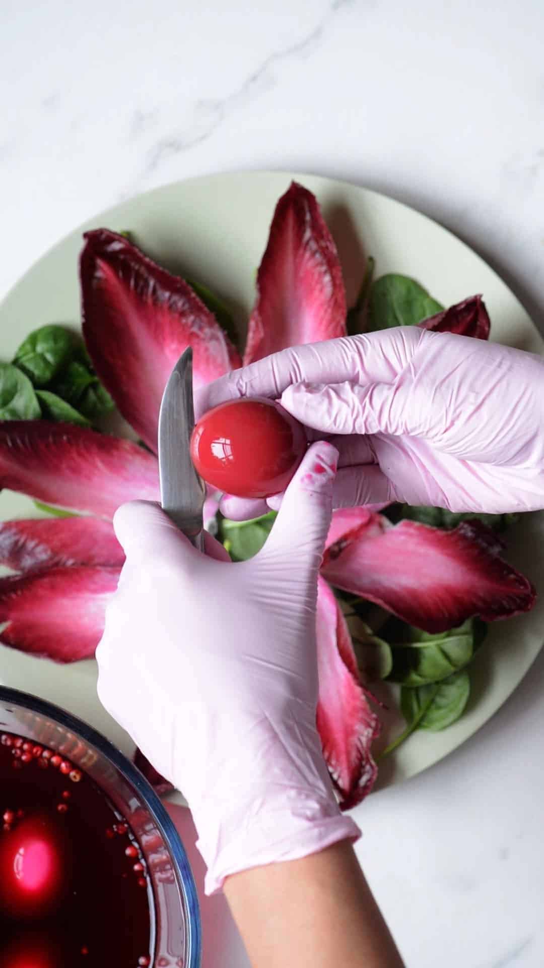 Cutting a naturally-colored pink egg