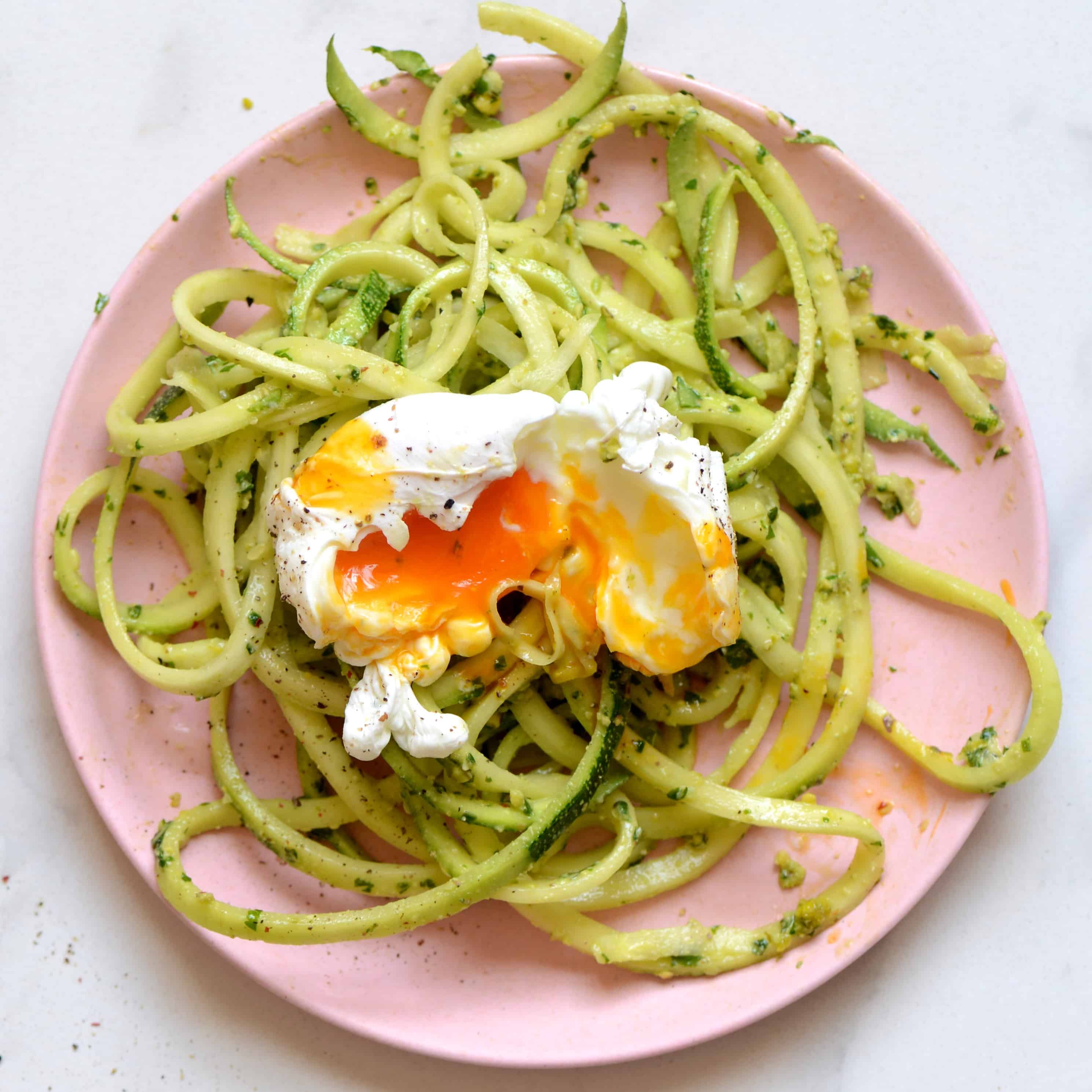 homemade pesto zoodles with a poached egg