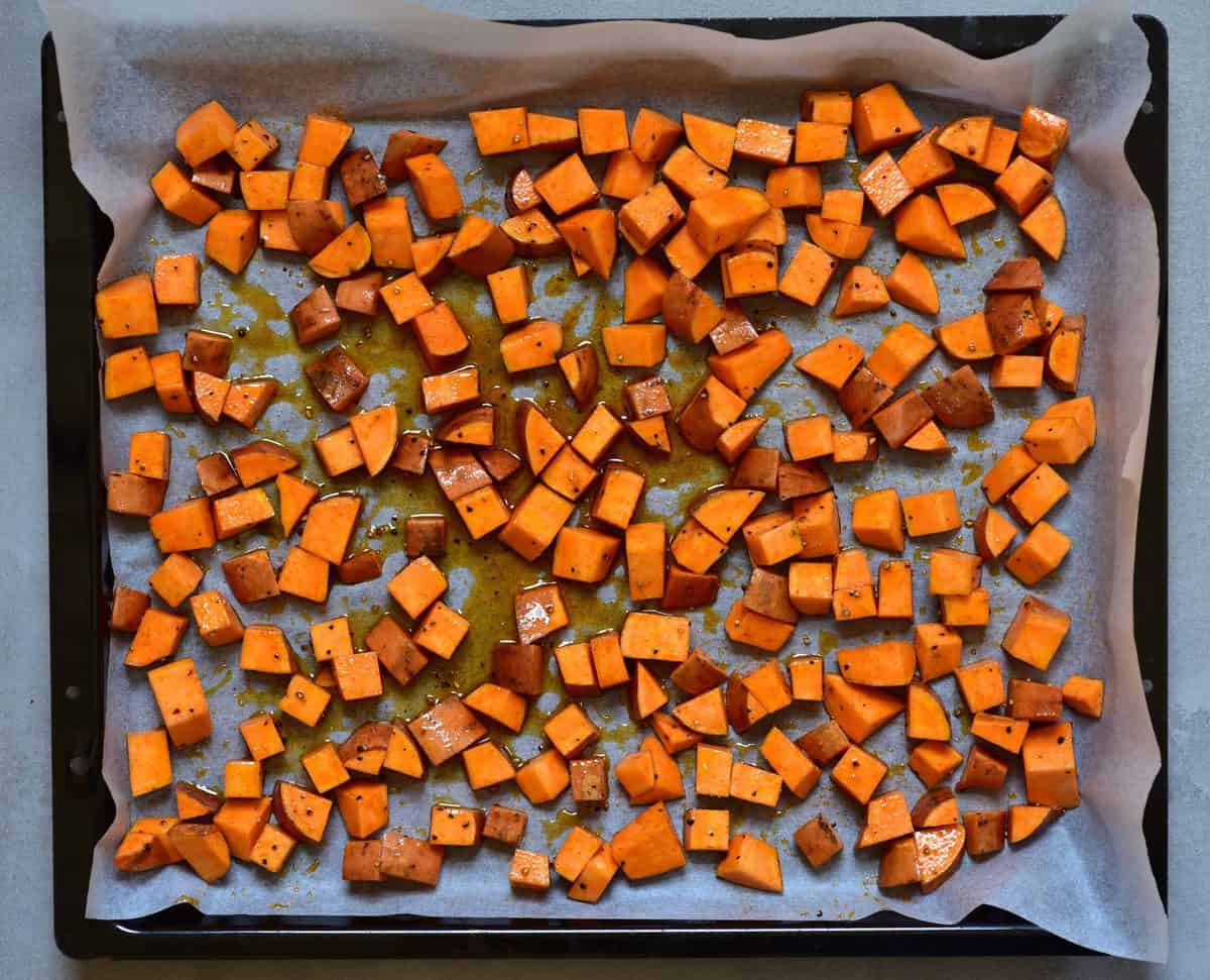 Chopped sweet potato on a baking tray 
