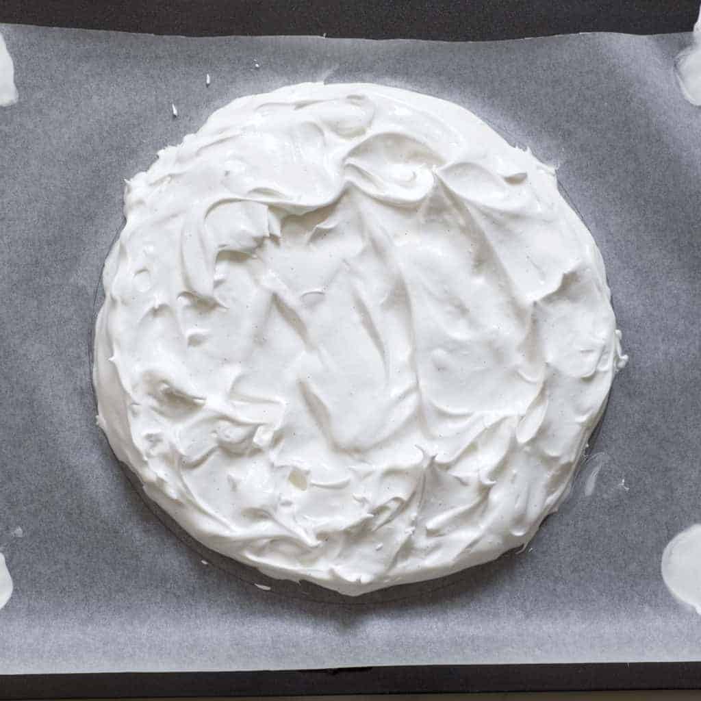 Eton mess meringue pavlova cake with berries and coconut cream