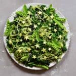 Fresh green home-made green pasta salad with spinach, green pistachio basil pesto and Kale