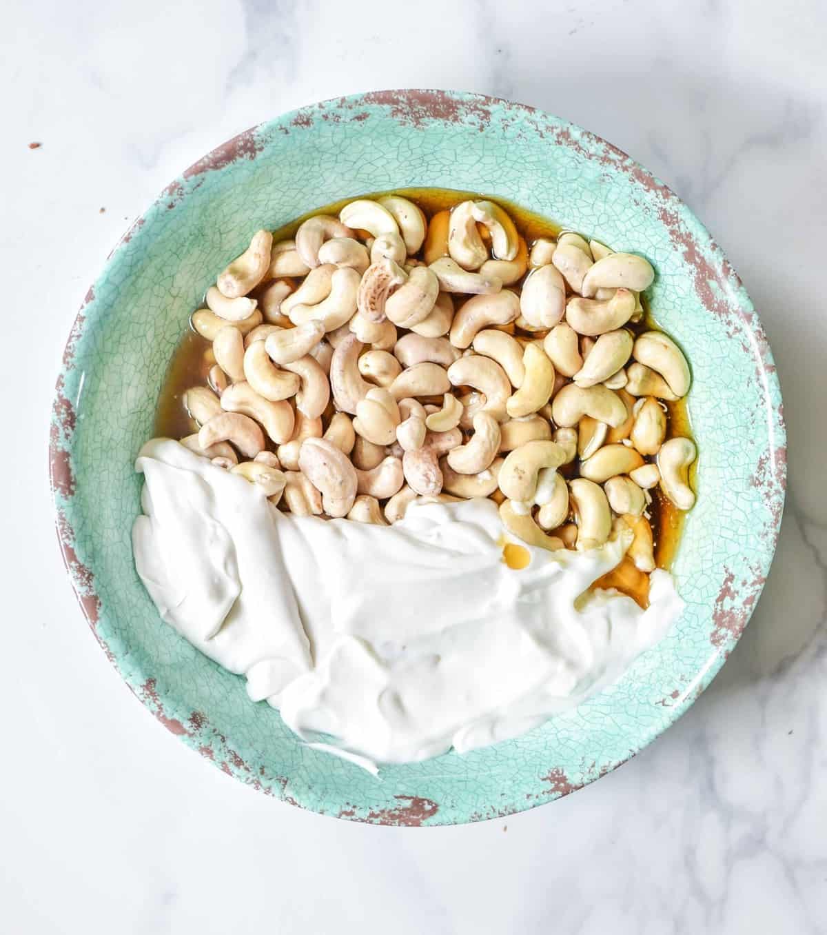 Cashews and coconut cream in a bowl