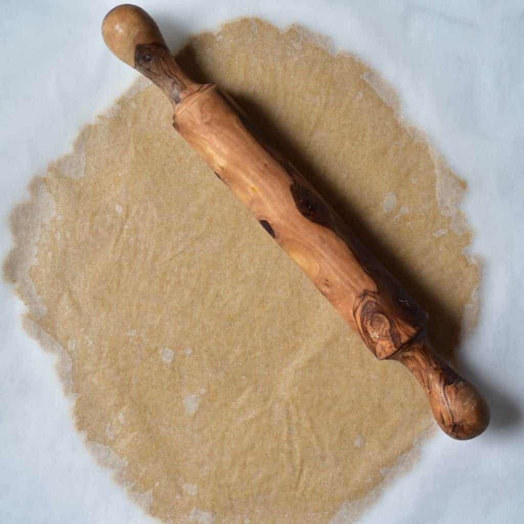 rolling out biscuit dough