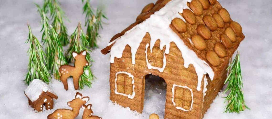 Gingerbread house with gingerbread characters in fruit of it