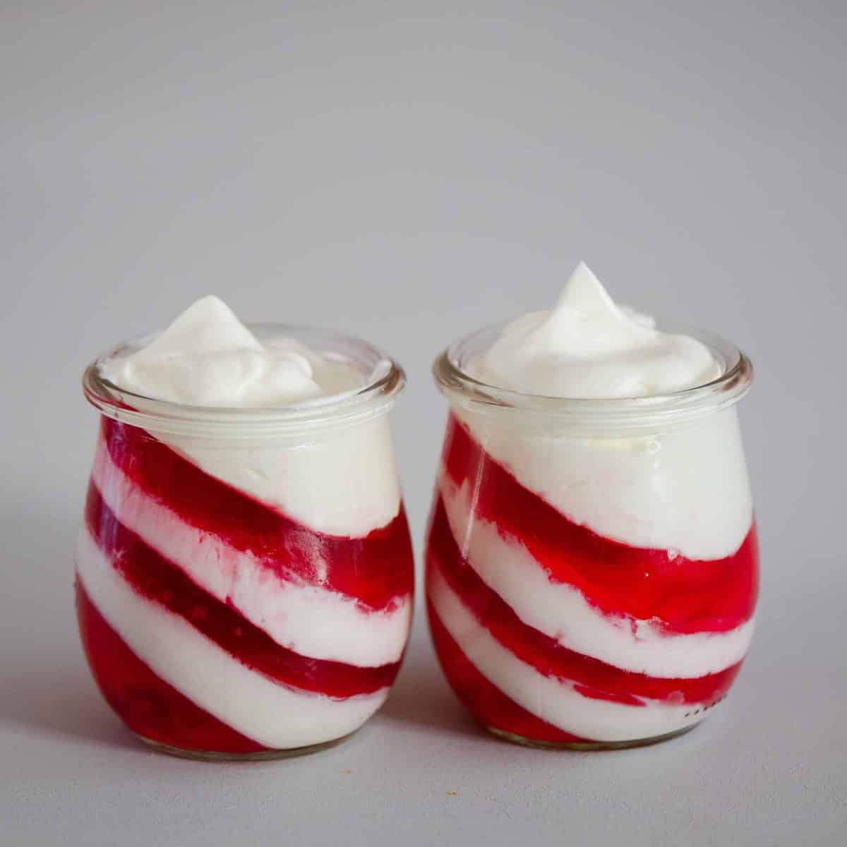 Candy cane jars with yogurt and strawberry jelly