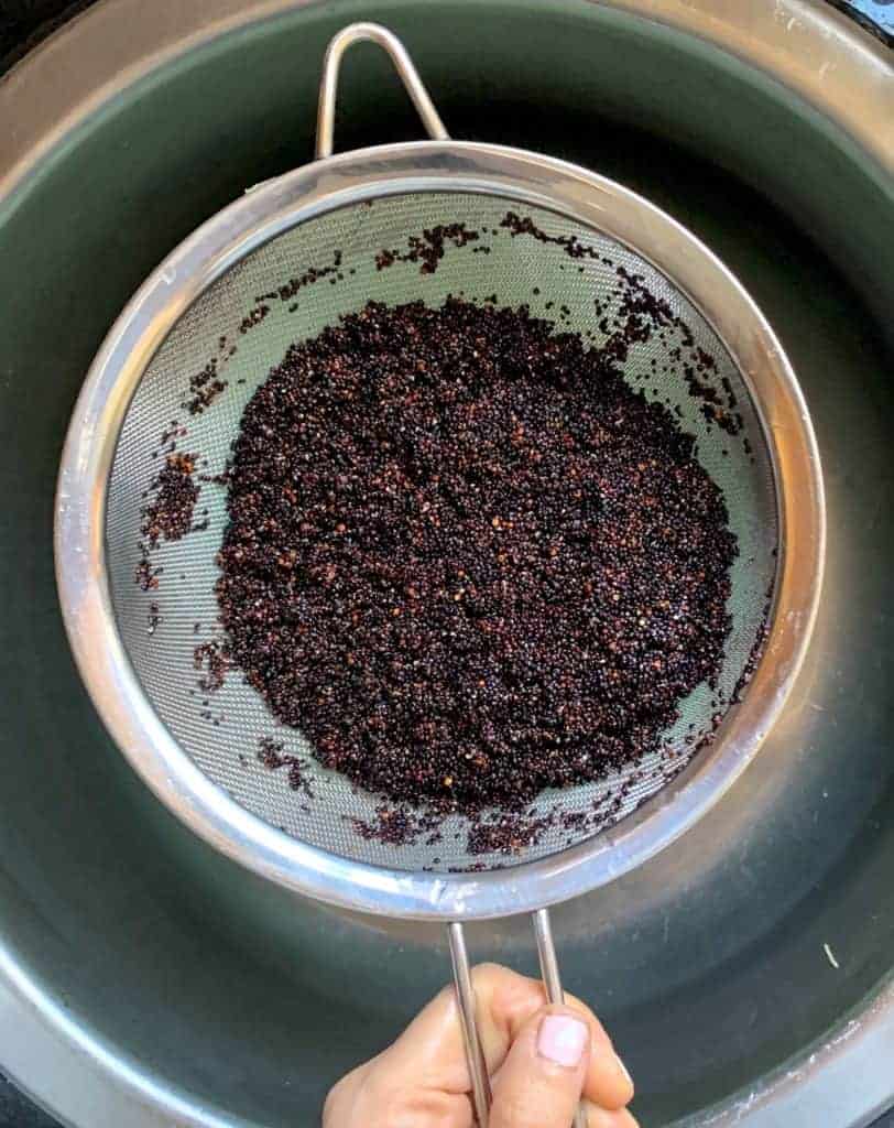 Rinsing quinoa in a sieve