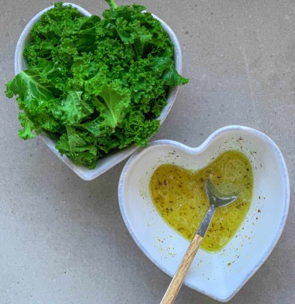 kale and dressing in separate bowls