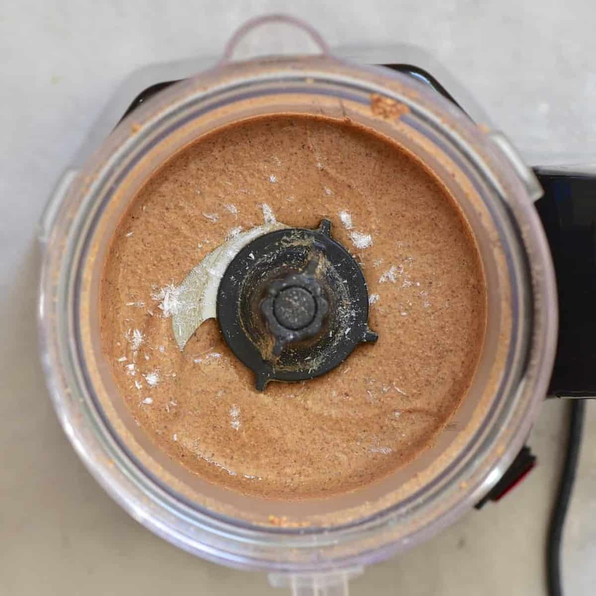 almond butter with a bit of salt inside the food processor 