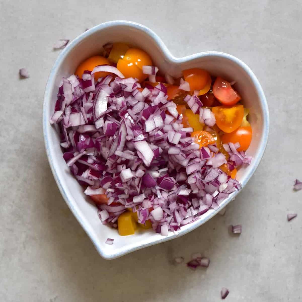chopped tomatoes and onions in a bowl