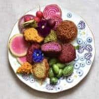 Rainbow falafel with veggies and edible flowers