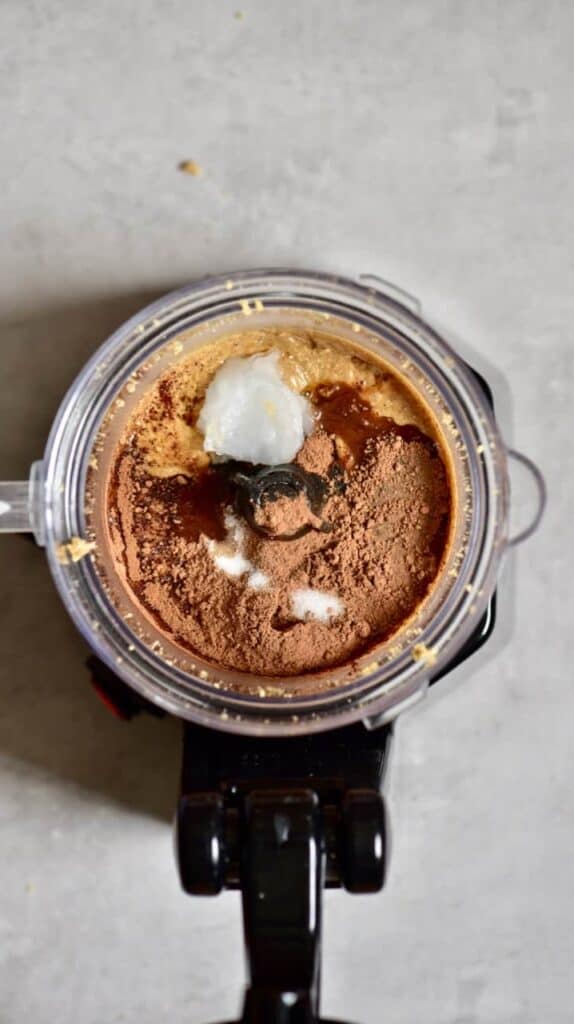 Hazelnut butter coconut oil and cacao powder in a blender