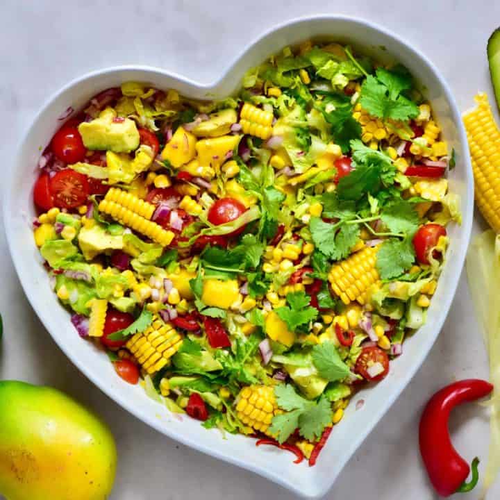 healthy rainbow summer salad with mango, sweetcorn & avocado. Perfect vegetarian bbq recipe and vegetarian salad.