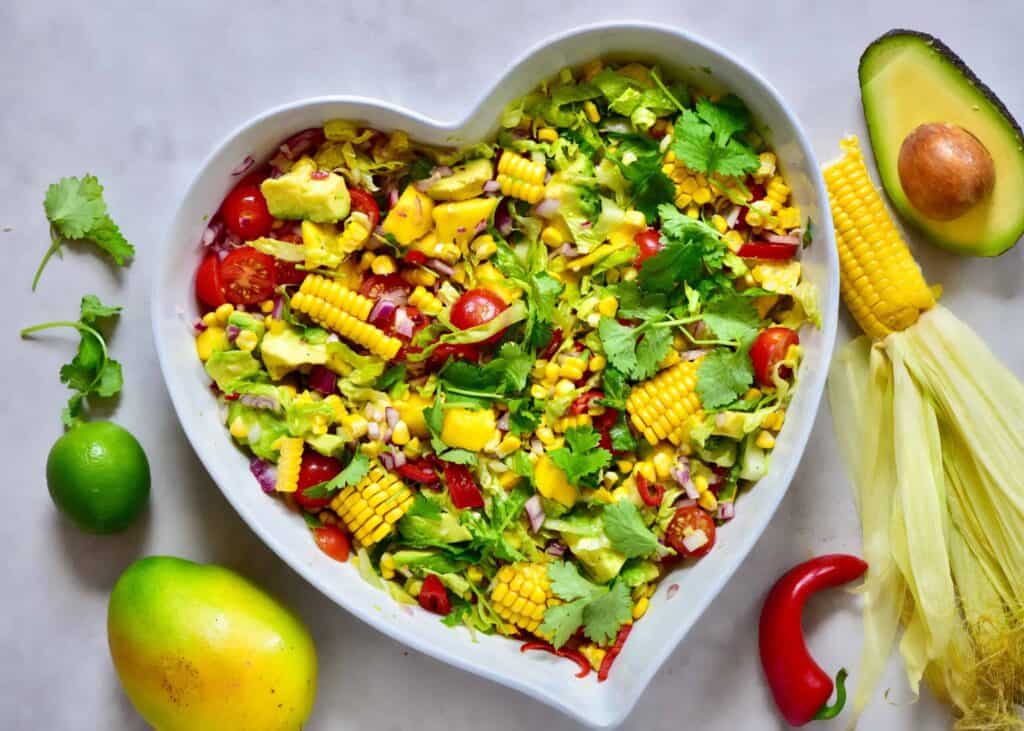 healthy rainbow summer salas with mango, sweetcorn & avocado. Perfect vegetarian bbq recipe and vegetarian salad.