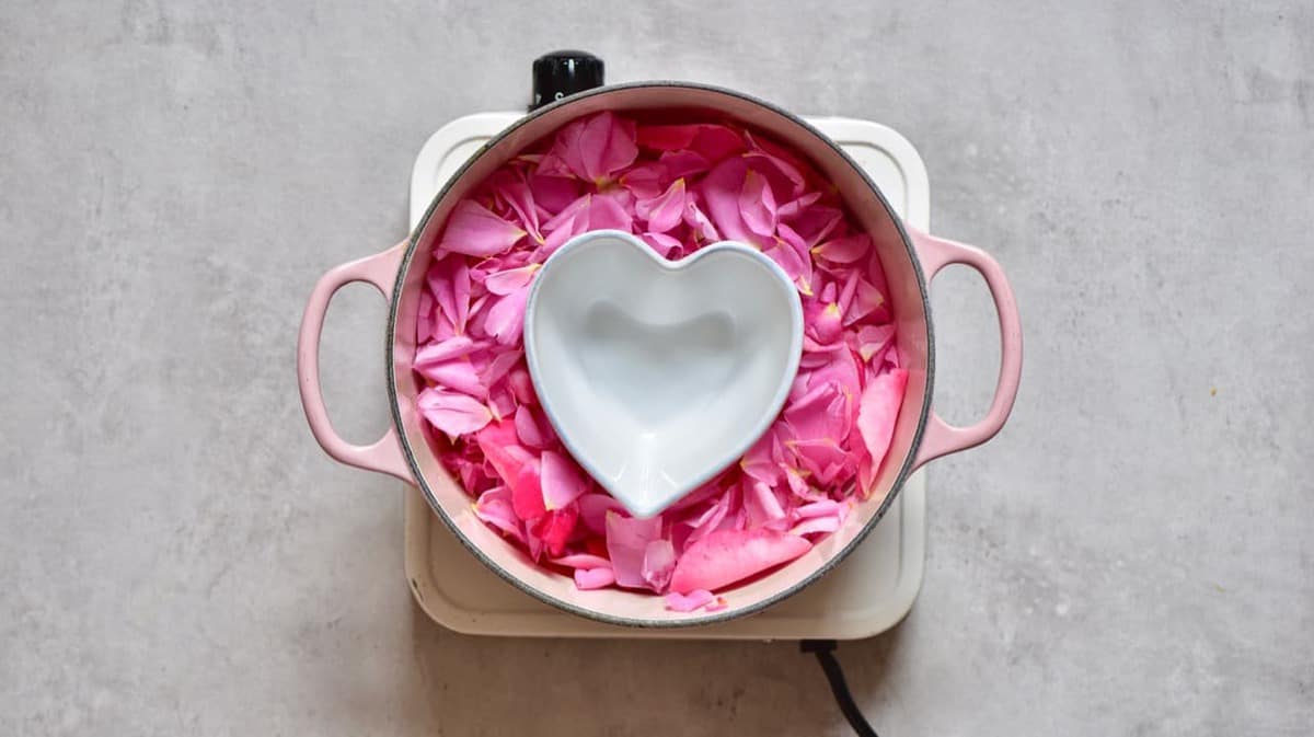 Rose petals in a pot with a bowl