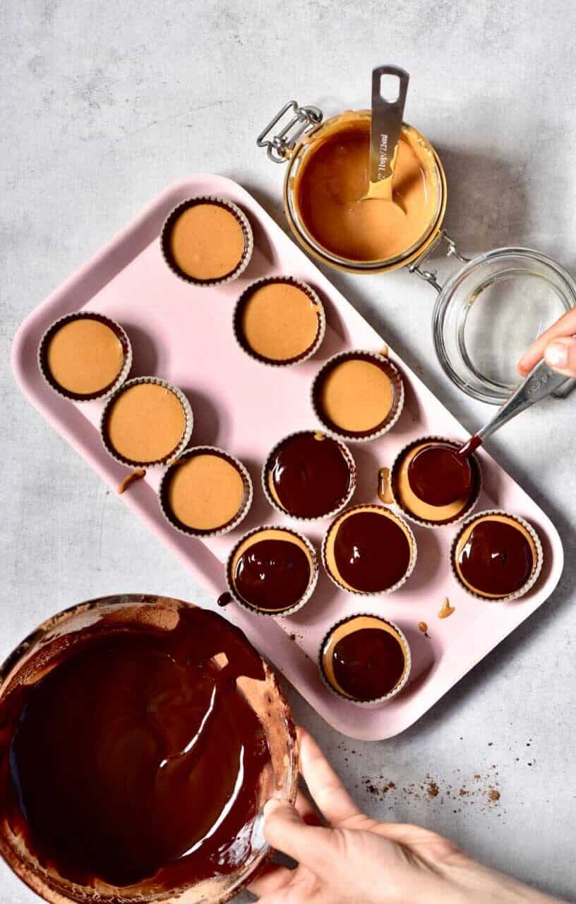 Healthy peanut butter cups covered with melted chocolate 