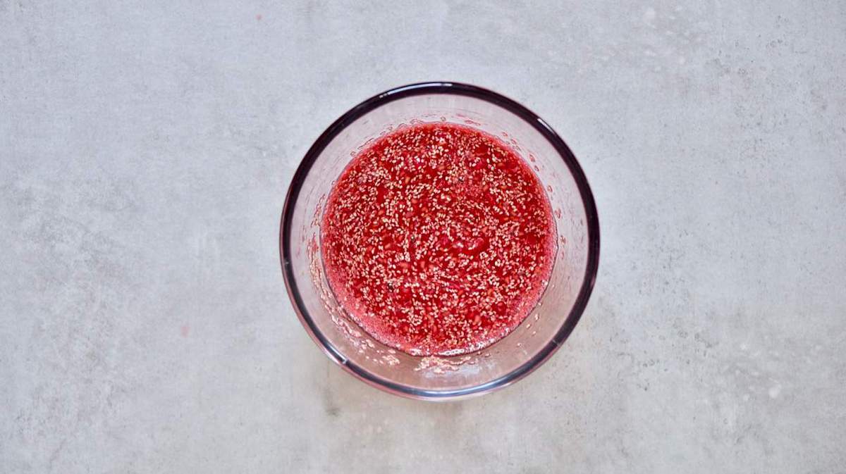 A small bowl filled with raspberry jam and chia seeds