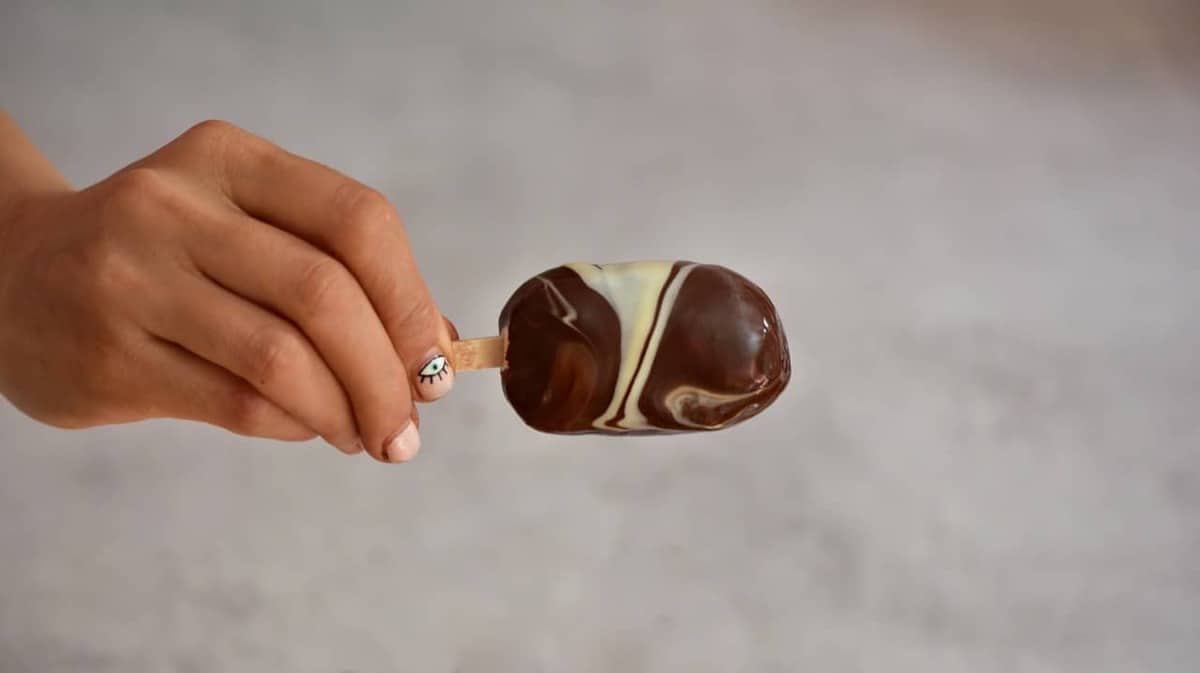A homemade magnum ice cream with chocolate coating