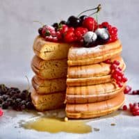 thick, fluffy japanese style pancakes with fresh berries. Refined sugar free