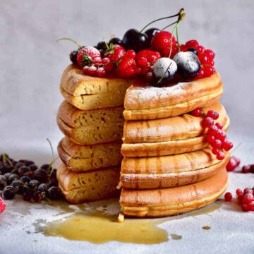 thick, fluffy japanese style pancakes with fresh berries. Refined sugar free