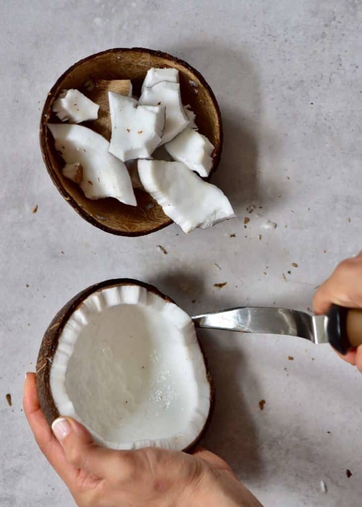Removing coconut flesh from shells