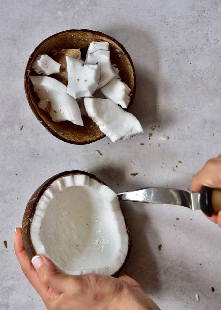 Removing coconut flesh from shells
