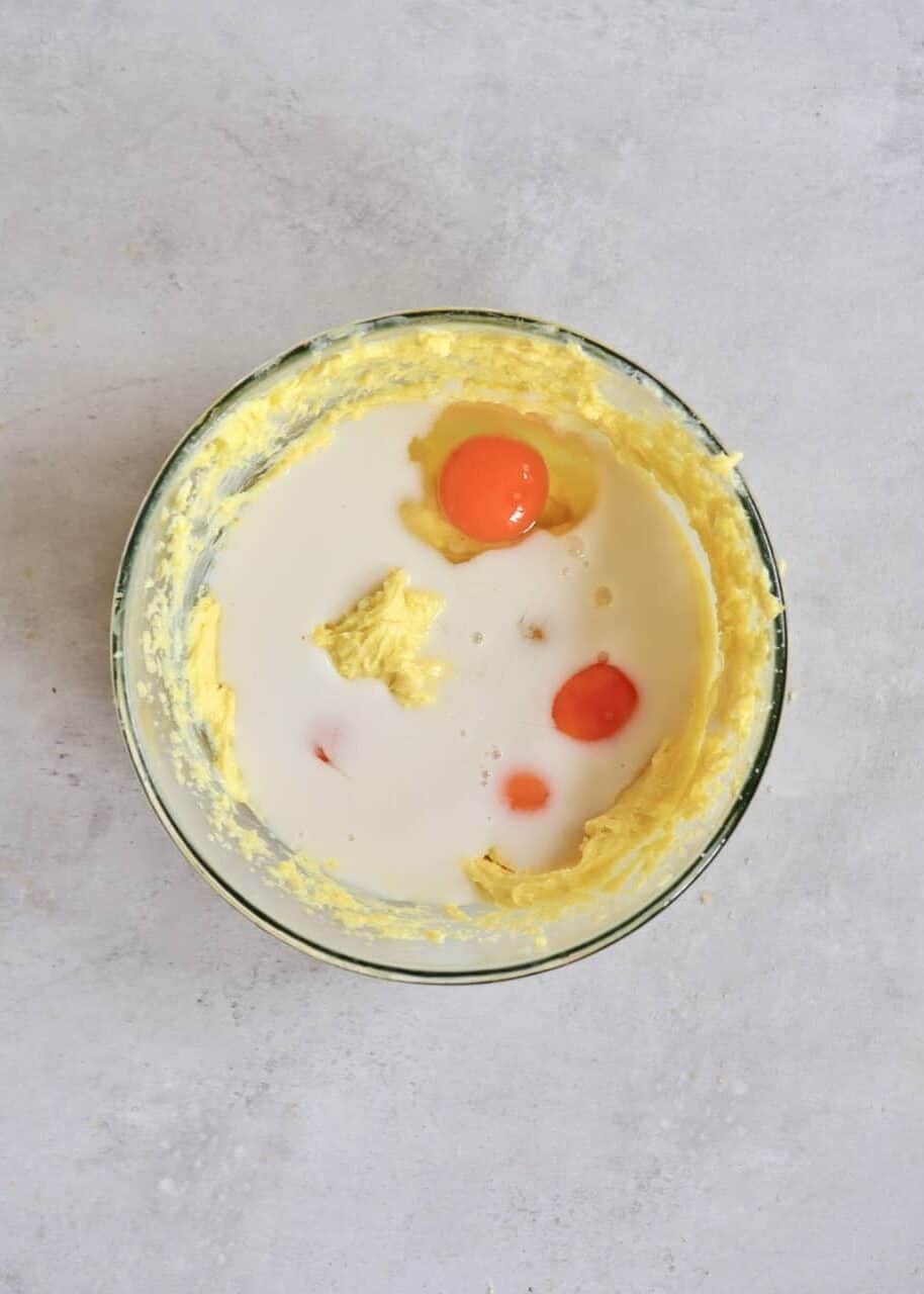 Mixing eggs with butter and milk