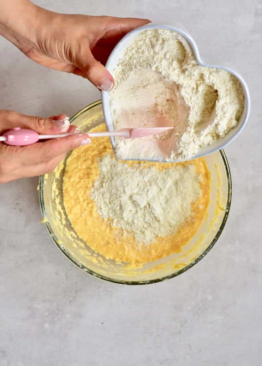 Mixing flour with whisked eggs