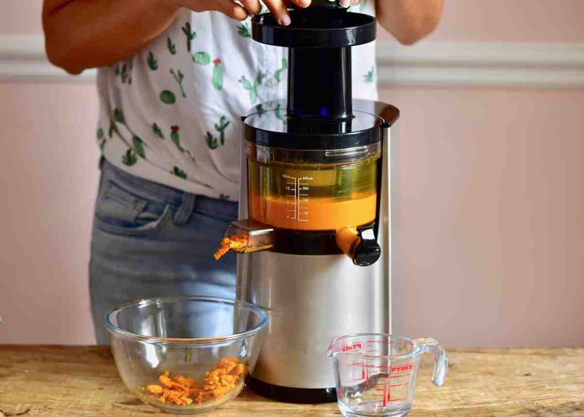 Making ginger turmeric energy shots in a juicer