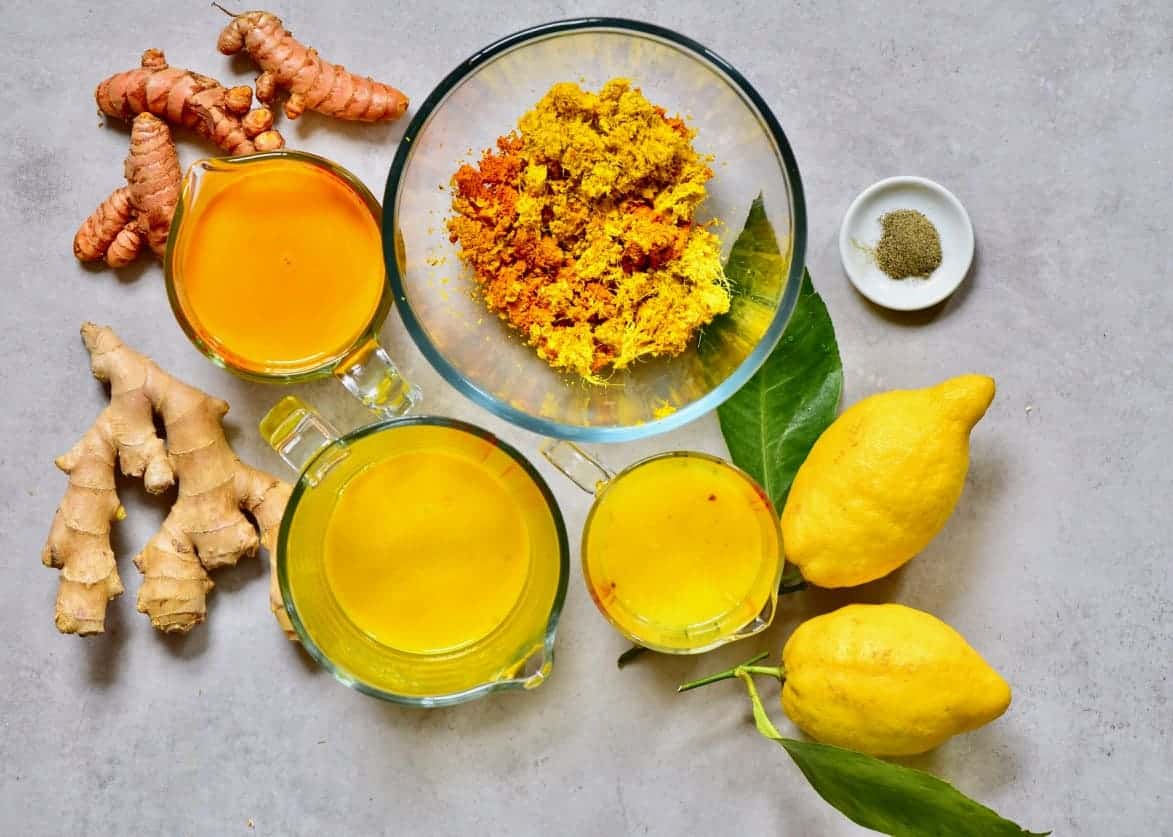 Turmeric juice, ginger juice, lemon juice, and pulp left from juicing them