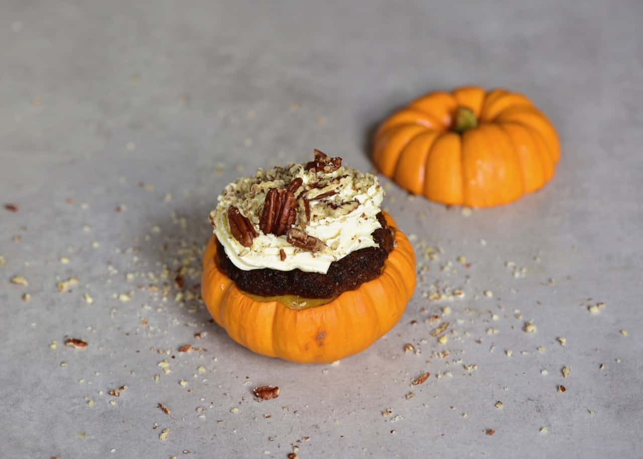 mini pumpkin cakes with coconut cream frosting and pecans