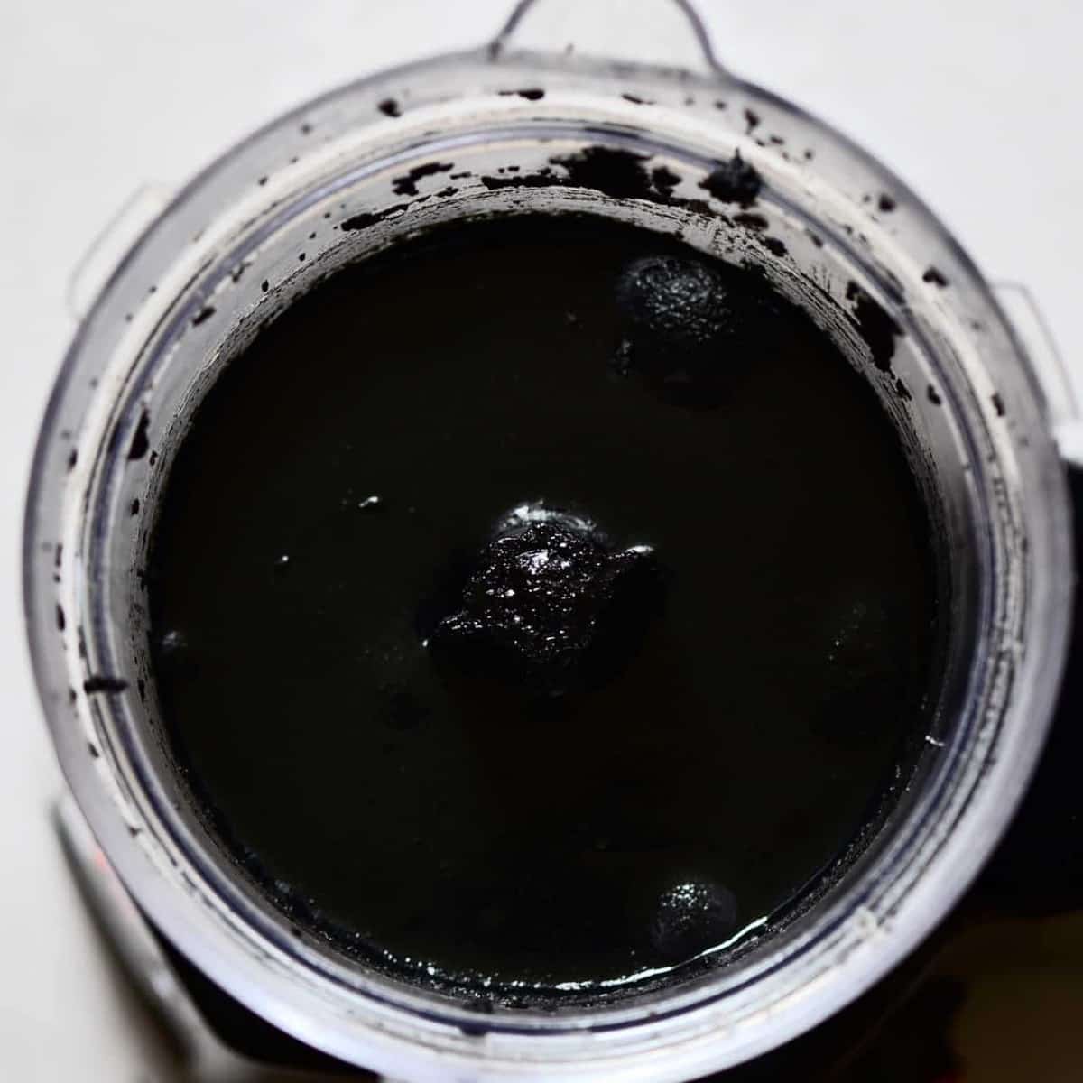 making homemade black tahini. black foods for halloween. black sesame seeds. two ingredient homemade black tahini