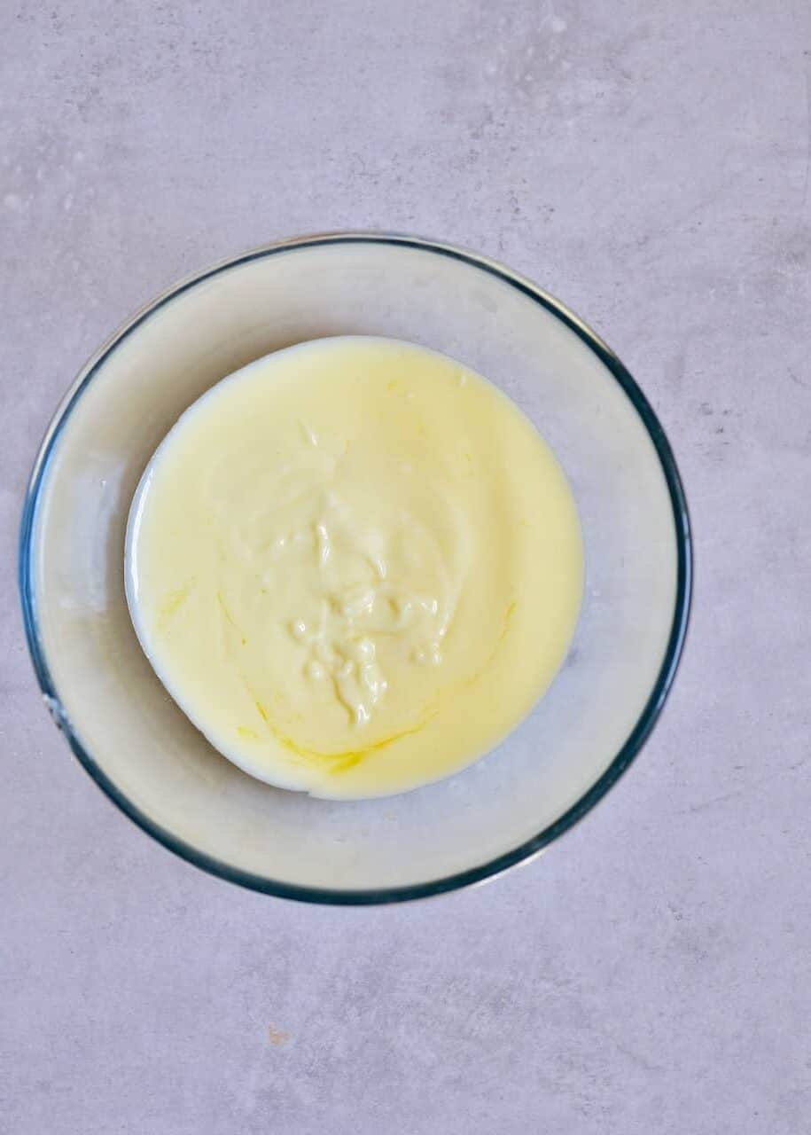 Vegan butter and oat milk in bowl