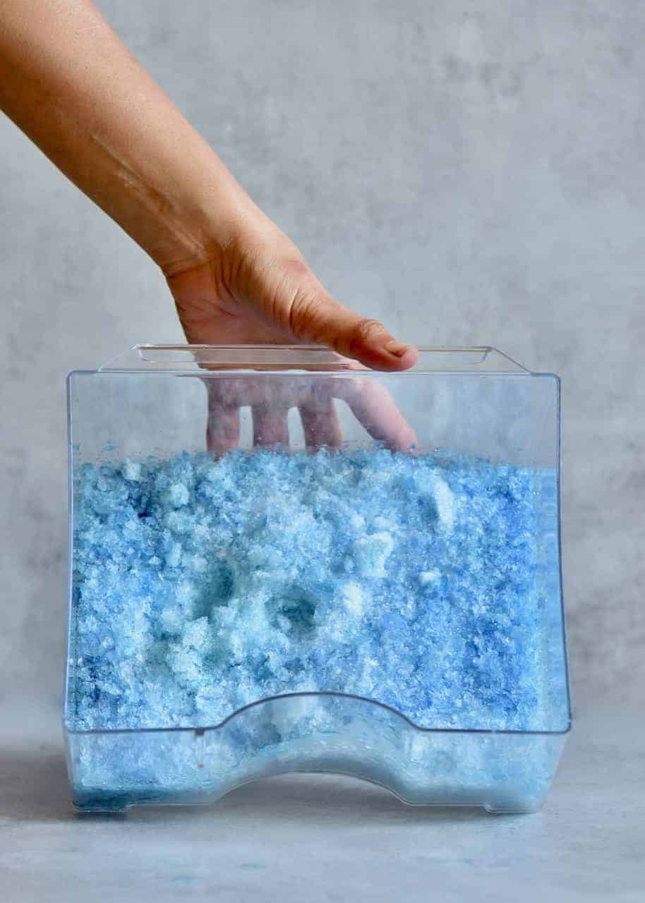 crushed blue ice in a container 