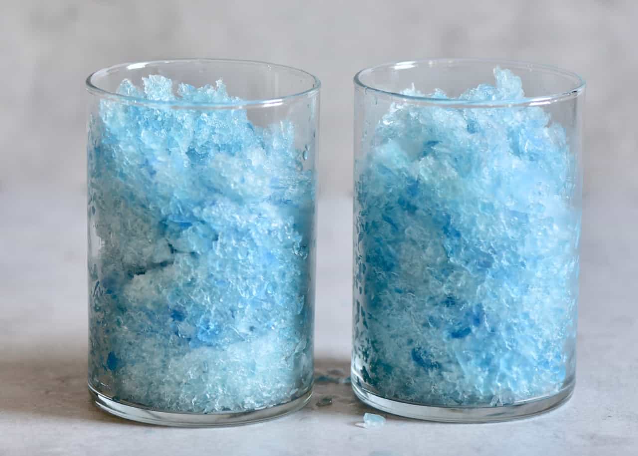 crushed blue butterfly ice in two identical glasses