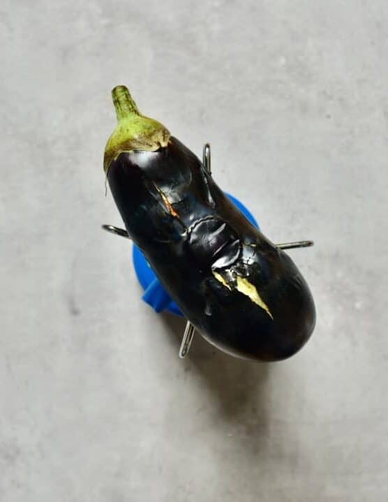 charring an eggplant/ aubergine over a naked flame