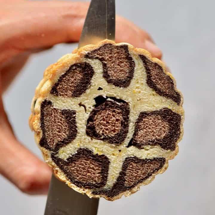 slicing into vegan leopard print brioche bread