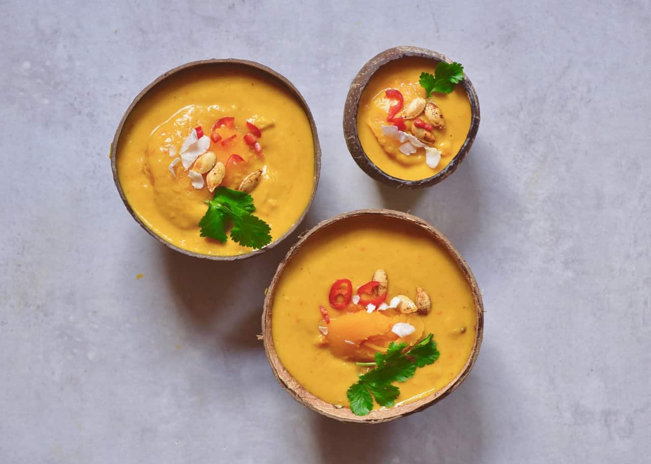 This coconut curry pumpkin soup uses just 15 ingredients and is a great easy pumpkin recipe for leftover pumpkins. Plus, it's 100% vegan and served in a pumpkin or coconut bowls