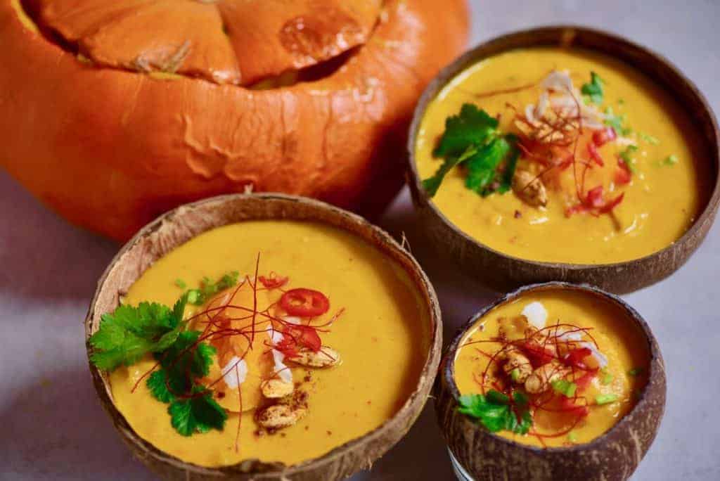 This coconut curry pumpkin soup uses just 15 ingredients and is a great easy pumpkin recipe for leftover pumpkins. Plus, it's 100% vegan and served in a pumpkin or coconut bowls