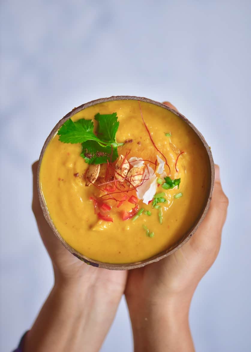 This coconut curry pumpkin soup uses just 15 ingredients and is a great easy pumpkin recipe for leftover pumpkins. Plus, it's 100% vegan and served in a pumpkin or coconut bowls