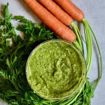 Simple vegetarian carrot leaf pesto recipe to help reduce waste, Plus can be made into a vegan pesto too! A delicious blend of pistachios, pine nuts, olive oil, cheese, lemon and seasonings