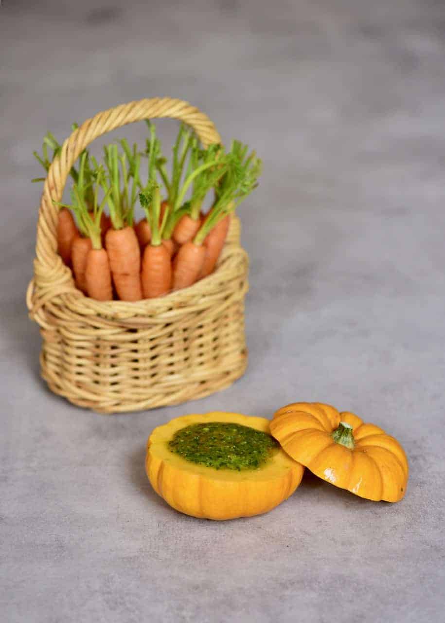 Roasted mini pumpkin filled with carrot leaf pesto