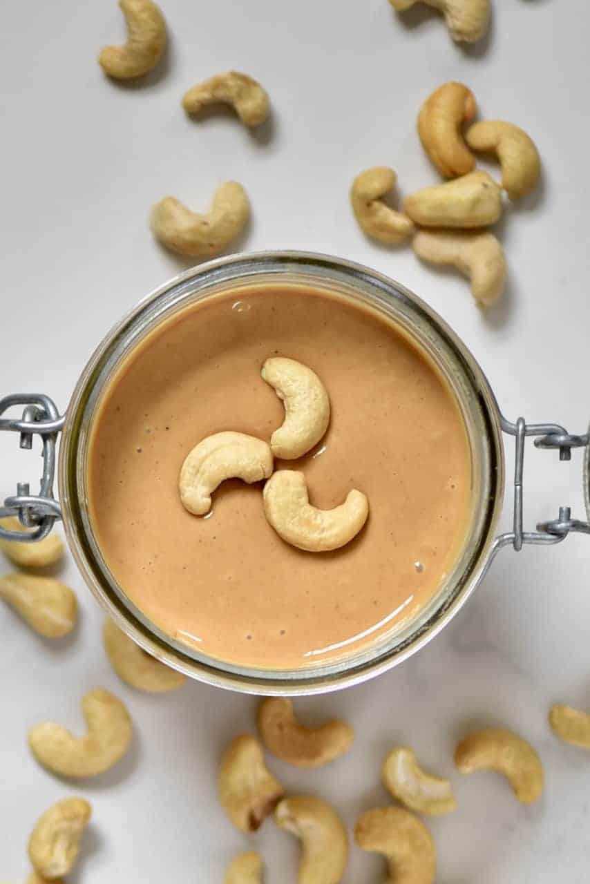 Delicious one ingredient homemade cashew butter recipe . Inlcuding flavoured cashew butter options as well as how to use cashew butter 