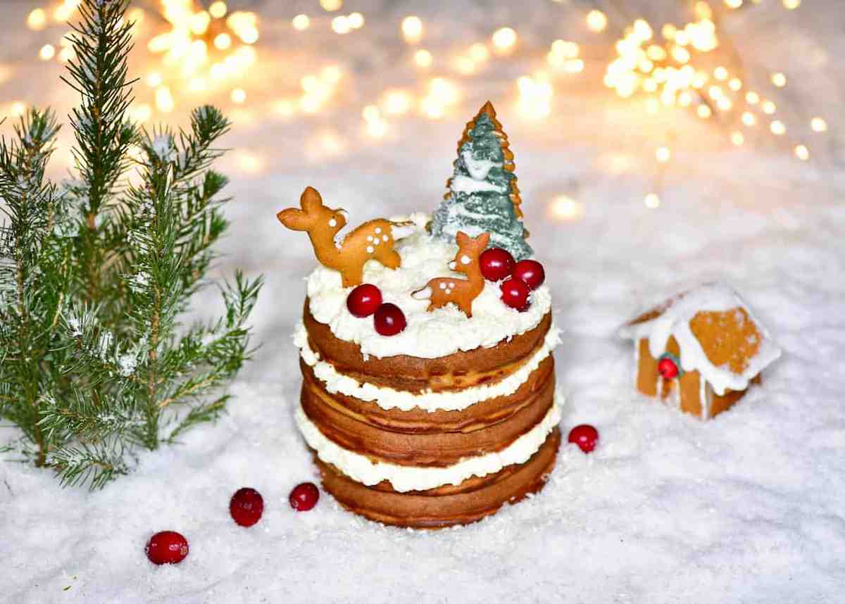 Delicious Christmas fluffy gingerbread pancakes recipe. A wonderful christmas dessert recipe of fluffy pancakes served with coconut whipped cream and berries