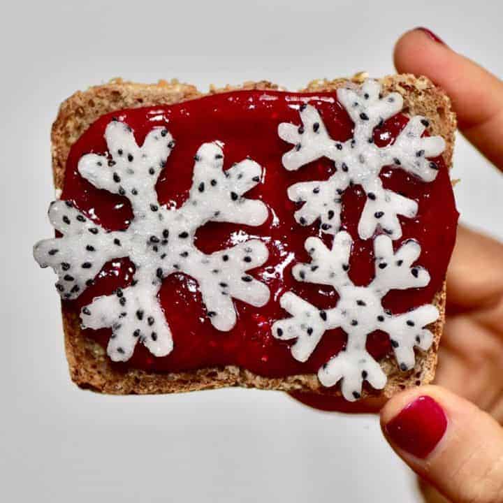 Christmas breakfast ideas perfect for christmas day breakfast - 9 healthy Christmas toast recipes including homemade nut butters, coconut yogurt and fruits. Plus these are easy Christmas recipes for Children - Using homemade cranberry sauce and dragonfruit snowflakes