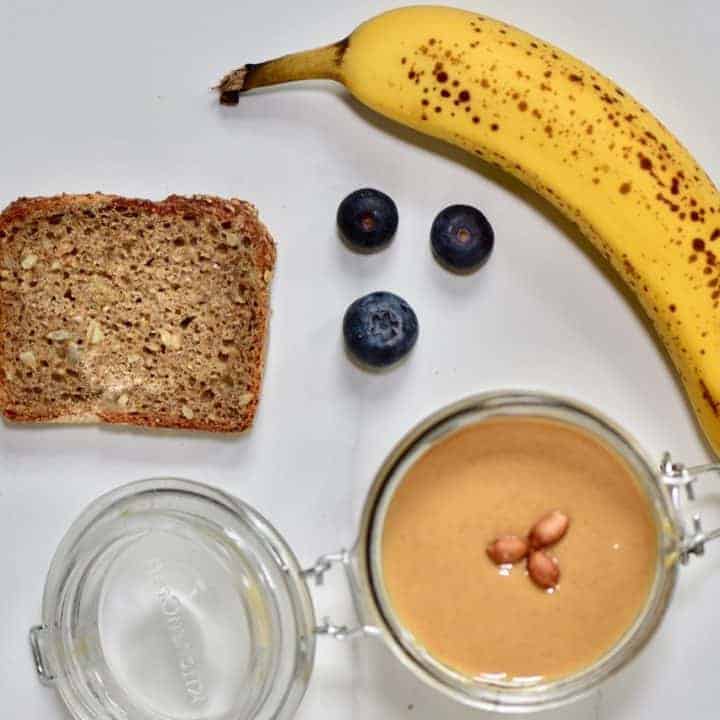 healthy toast recipe with homemade almond butter, banana and blueberries