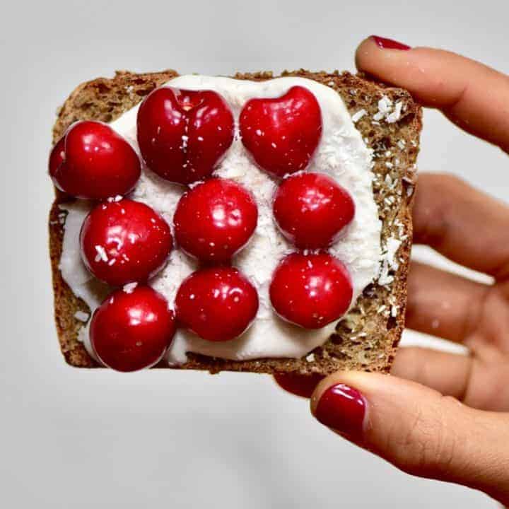 Christmas breakfast ideas perfect for christmas day breakfast - 9 healthy Christmas toast recipes including homemade nut butters, coconut yogurt and fruits. Plus these are easy Christmas recipes for Children - healthy toast with homemade vegan coconut yogurt, cherries and desiccated coconut