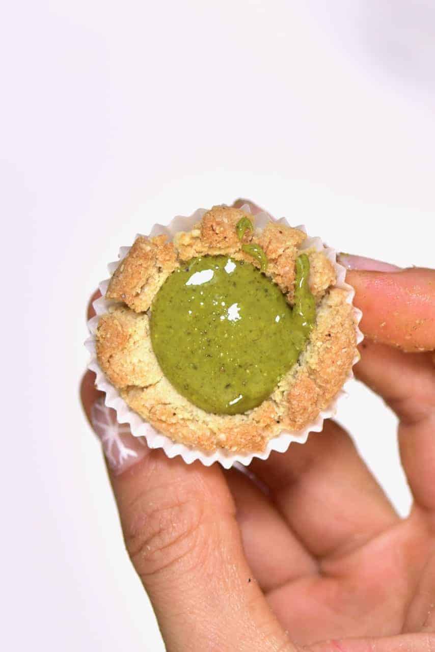 Delicious gluten-free, vegan bite-size snacks; almond & pistachio thumbprint cookies recipe. Not only are they easy to make- they can either be baked or kept as a no-bake cookie recipe!