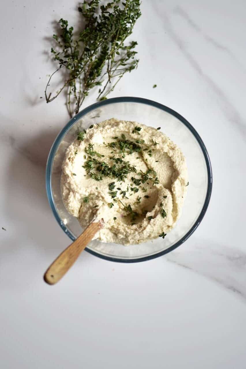 adding thyme to cheese