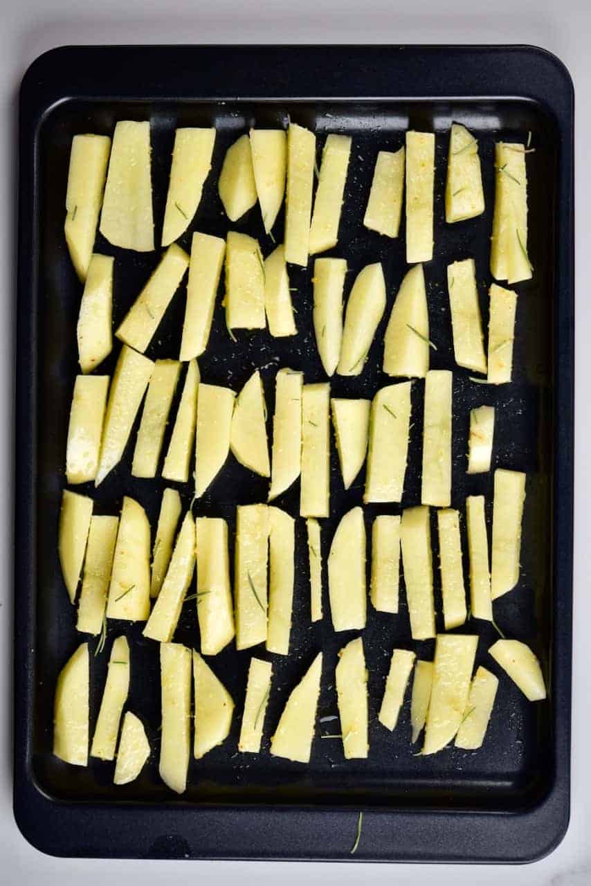 homemade potato oven baked fries on a baking tray